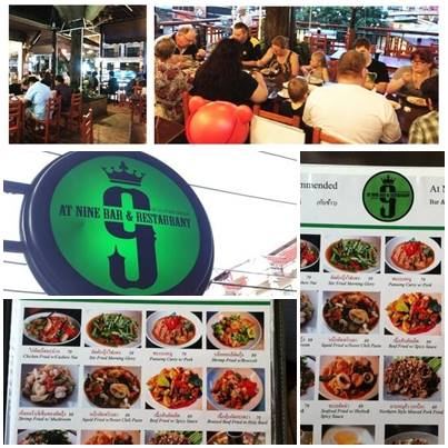 ภาพรวมร้าน At Nine Bar & Restaurant มีลูกค้านั่งที่โต๊ะ ป้ายวงกลมสีเขียวเลข 9 และเมนูอาหาร